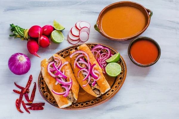 depositphotos_294171558-stock-photo-tortas-ahogadas-traditional-mexican-food